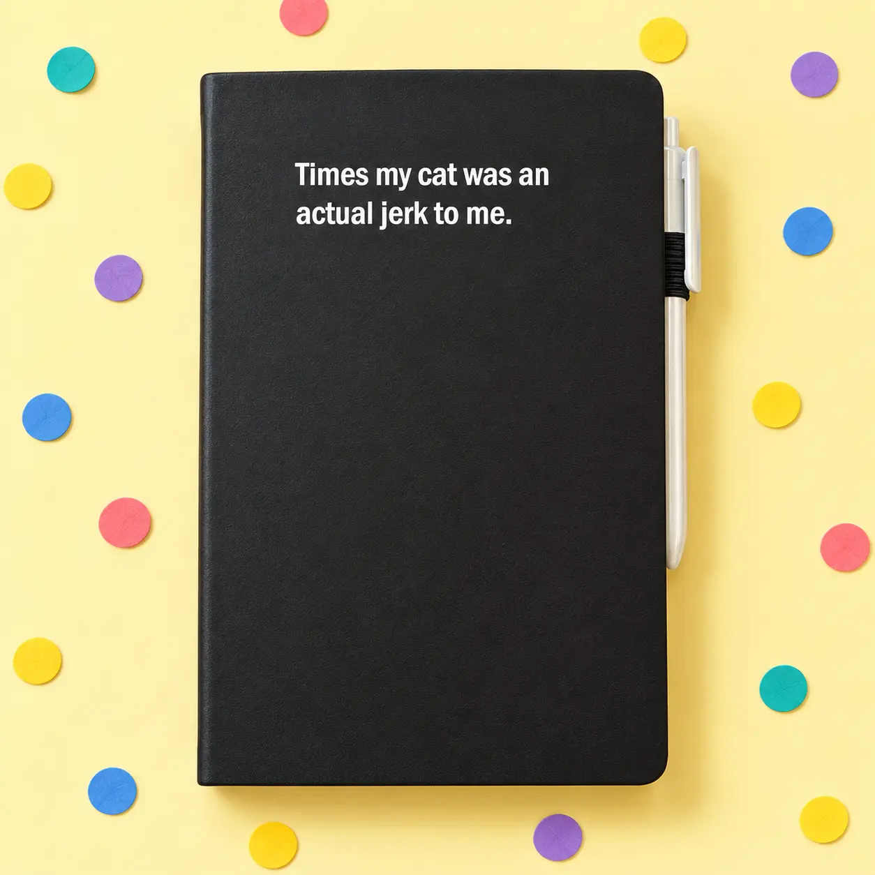 Black notebook reading Times my cat was an actual jerk to me